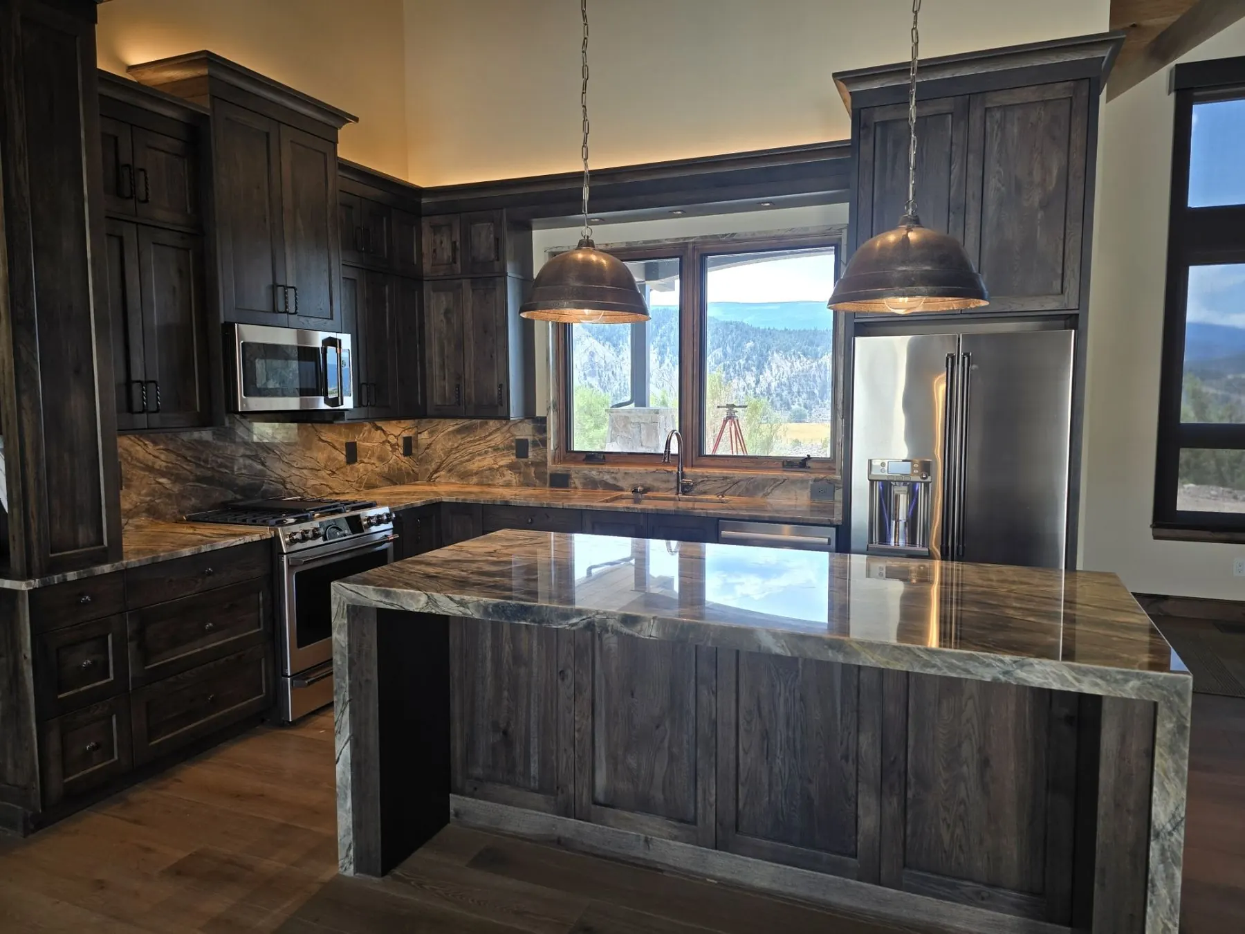 Finished custom kitchen with pendant and under-cabinet lighting by T&G Electric